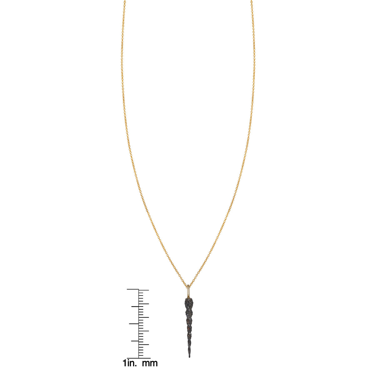 Phoenix Roze black diamond unicorn horn necklace in 14k gold, shown with ruler for scale