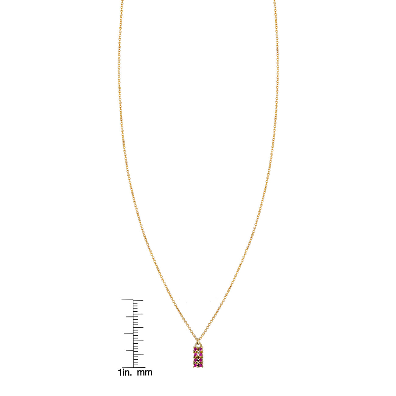 Phoenix Roze ruby gold tag necklace on a scale for size, delicate gold chain with bezel-set ruby pendant