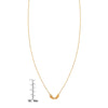 Small gold angel wings pendant necklace shown with ruler for size reference