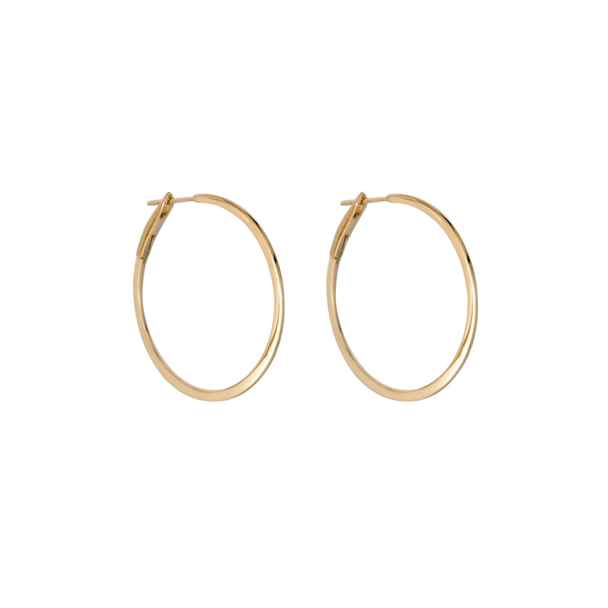 Side view of 1 1/4-inch skinny solid 14k gold hoop earrings, lightweight everyday hoops by Phoenix Roze