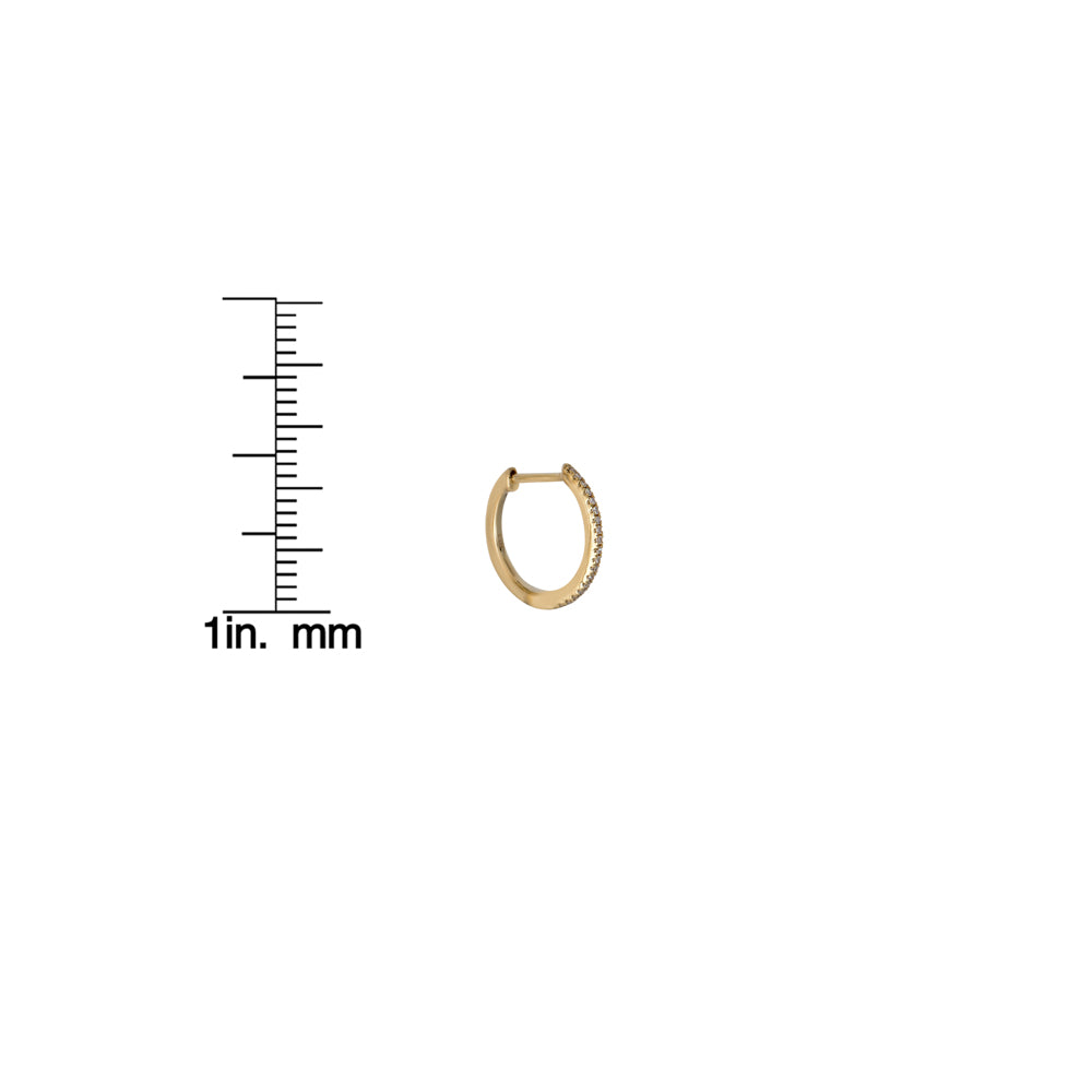 Side view of 12mm diamond huggie gold hoop earring beside ruler for size reference