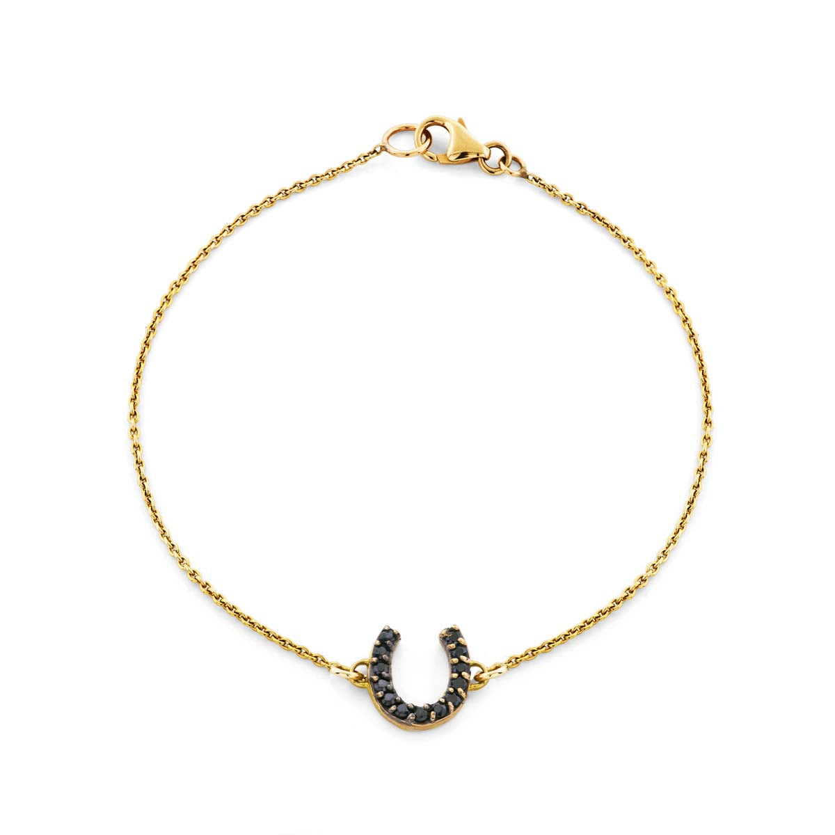 14k yellow gold horseshoe bracelet with black diamonds, a modern lucky charm handcrafted in NYC