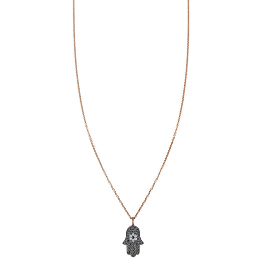 Black and white diamond evil eye Hamsa necklace with white diamond flower center and pavé black diamonds, protective talisman
