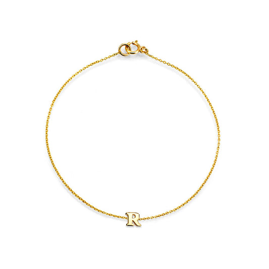 Personalized 14k gold initial bracelet with delicate letter charm—handcrafted in NYC for elegant everyday wear