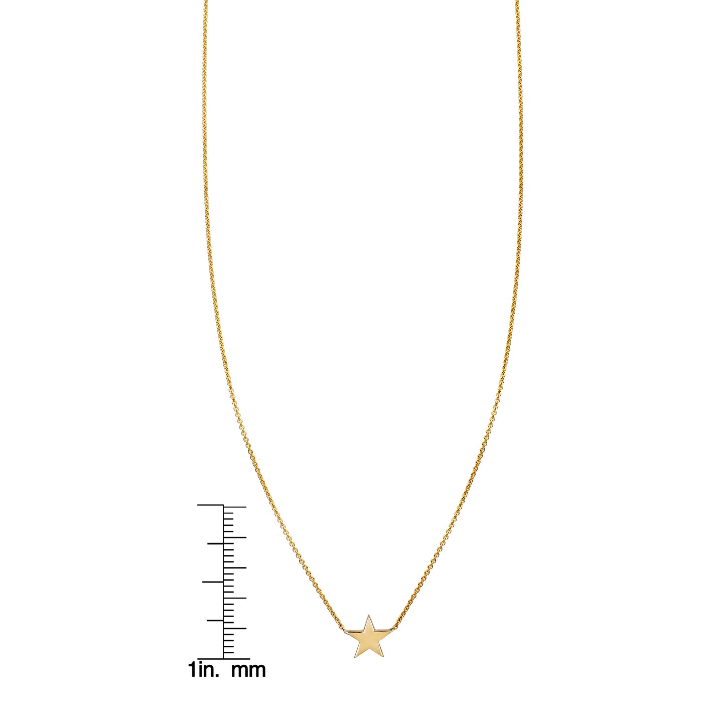 Large gold star pendant necklace by Phoenix Roze shown beside a ruler for scale.