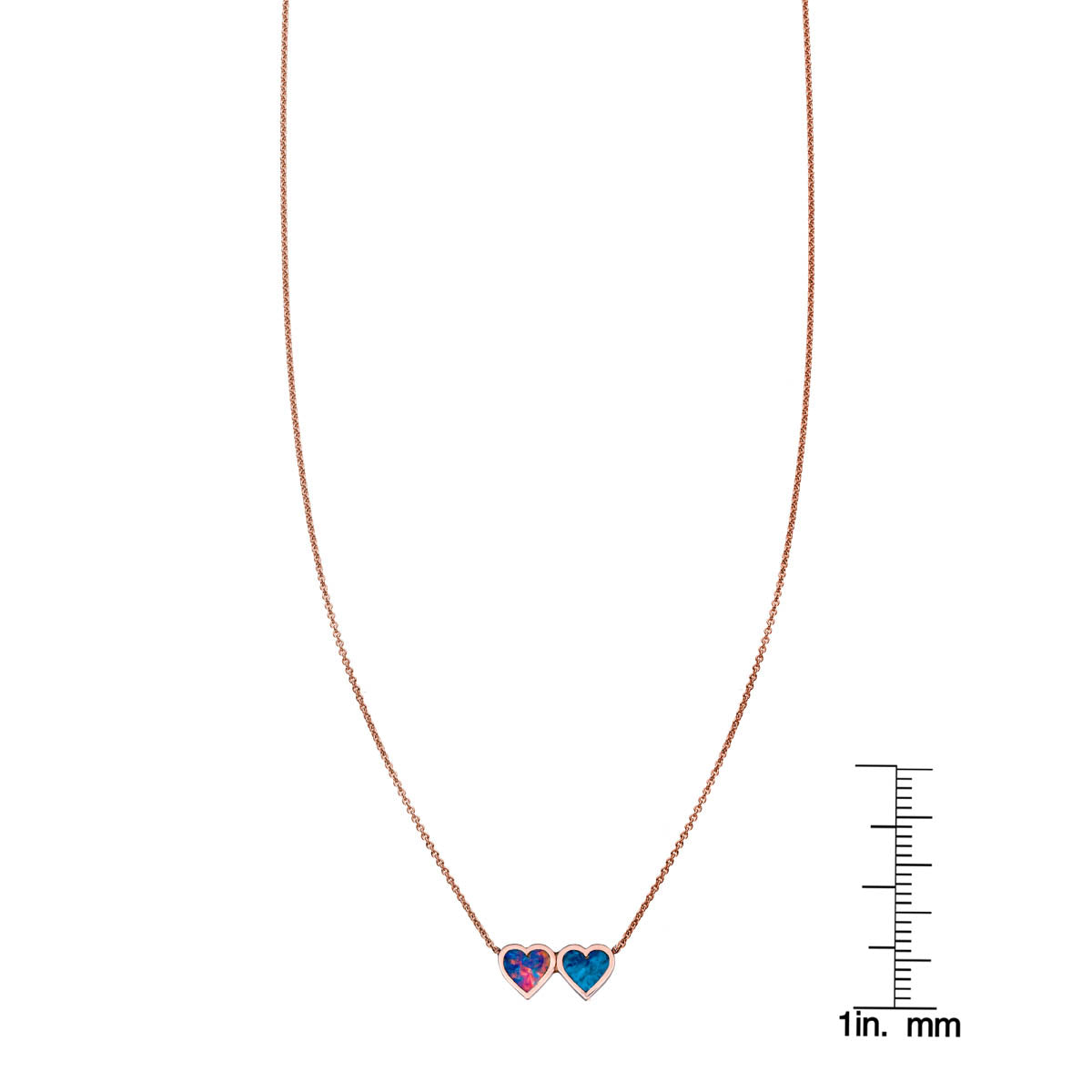 Opal and chrysocolla double heart necklace shown next to a ruler for size, delicate gold chain by Phoenix Roze.