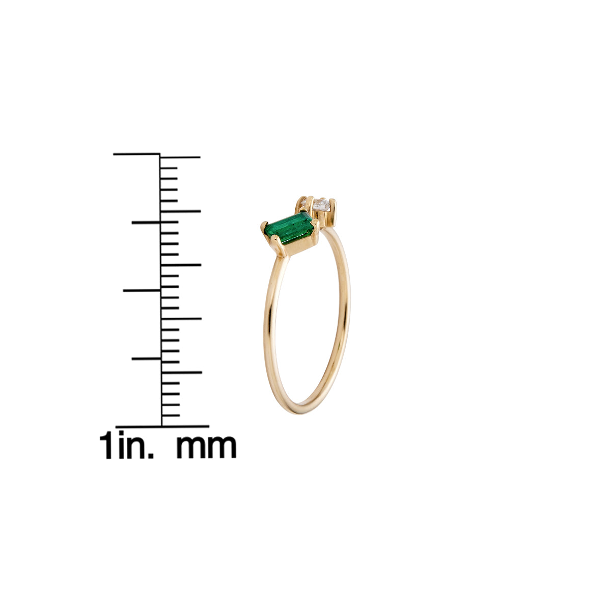 Sideways emerald and diamond ring in yellow gold, delicate band with sparkling accents