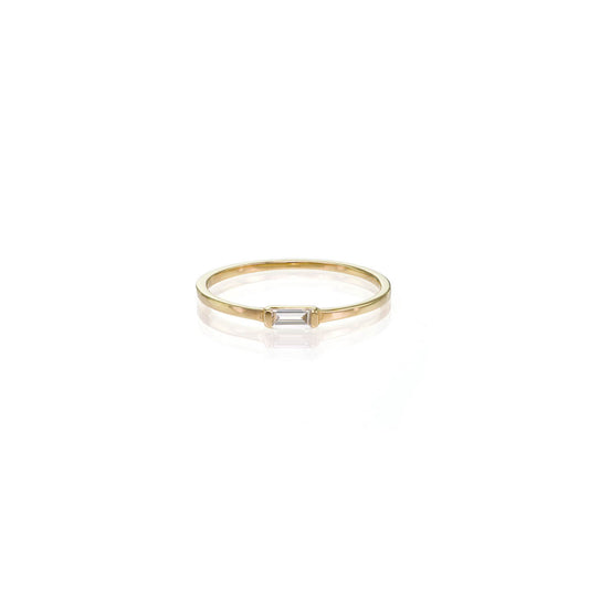 Single Baguette Diamond Ring: delicate gold band with .10 ct baguette-cut white diamond, perfect engagement or promise ring