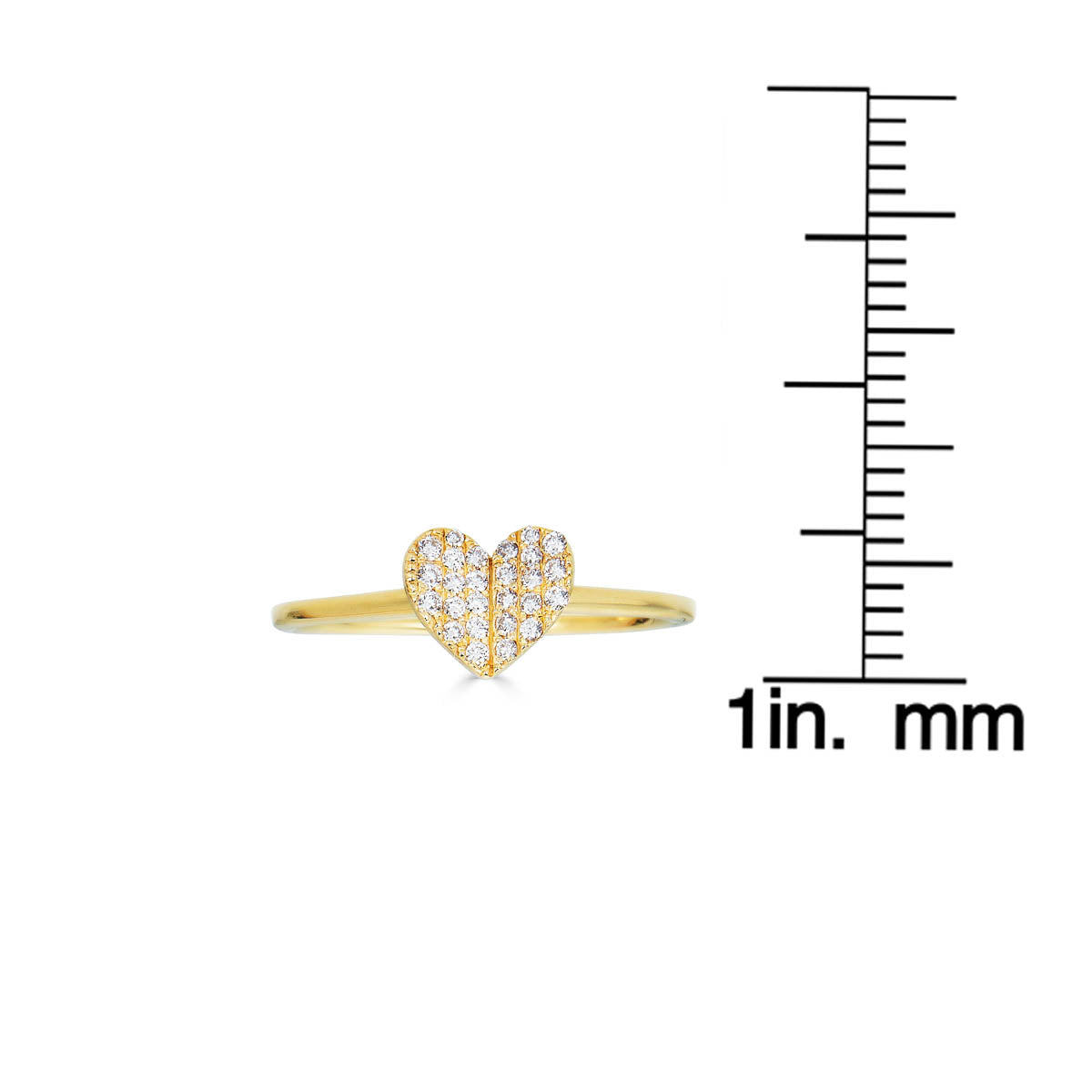 Small white diamond folded heart ring next to a ruler, highlighting delicate size and sparkle
