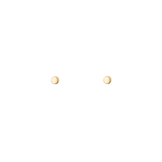 Tiny gold dot stud earrings in solid 14k yellow gold—minimalist, lightweight everyday studs.
