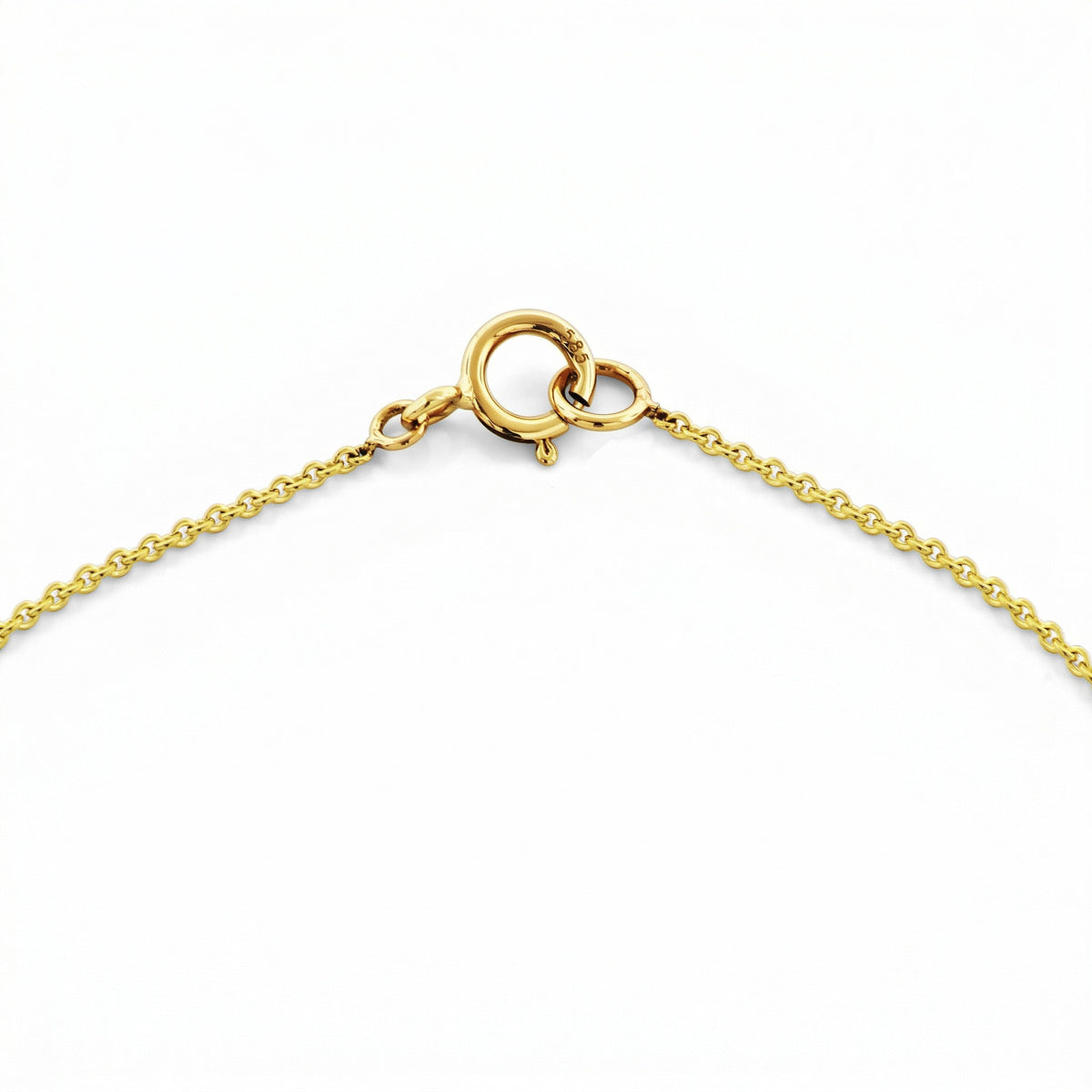 Close-up of 14k yellow gold spring ring clasp on fine chain necklace