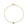 Handmade 14k yellow gold opal star bracelet with blue-green inlay on white background
