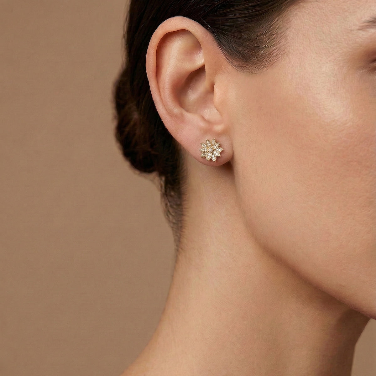 14k gold diamond lotus flower stud earring worn on model showing scale and placement