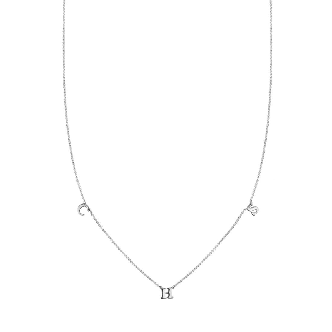Custom three-letter sterling silver initial necklace with spaced 'C', 'H', and 'S' charms.
