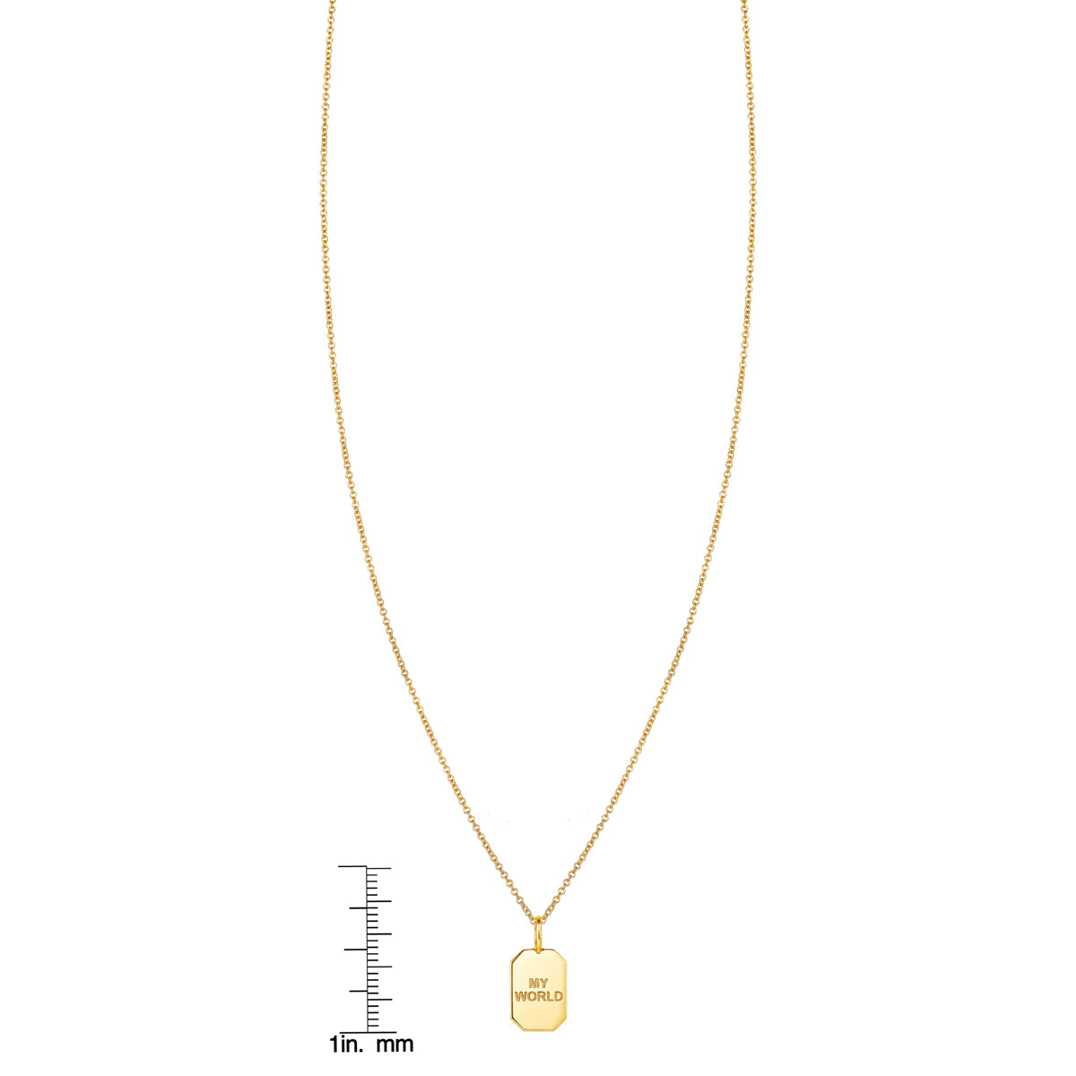 My World gold tag pendant shown next to a ruler for size reference
