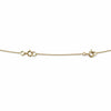 Gold necklace extender on a white background