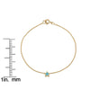 14k yellow gold turquoise star bracelet worn on model's wrist showing scale and fit