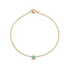 Handmade 14k yellow gold turquoise star bracelet with blue inlay on white background