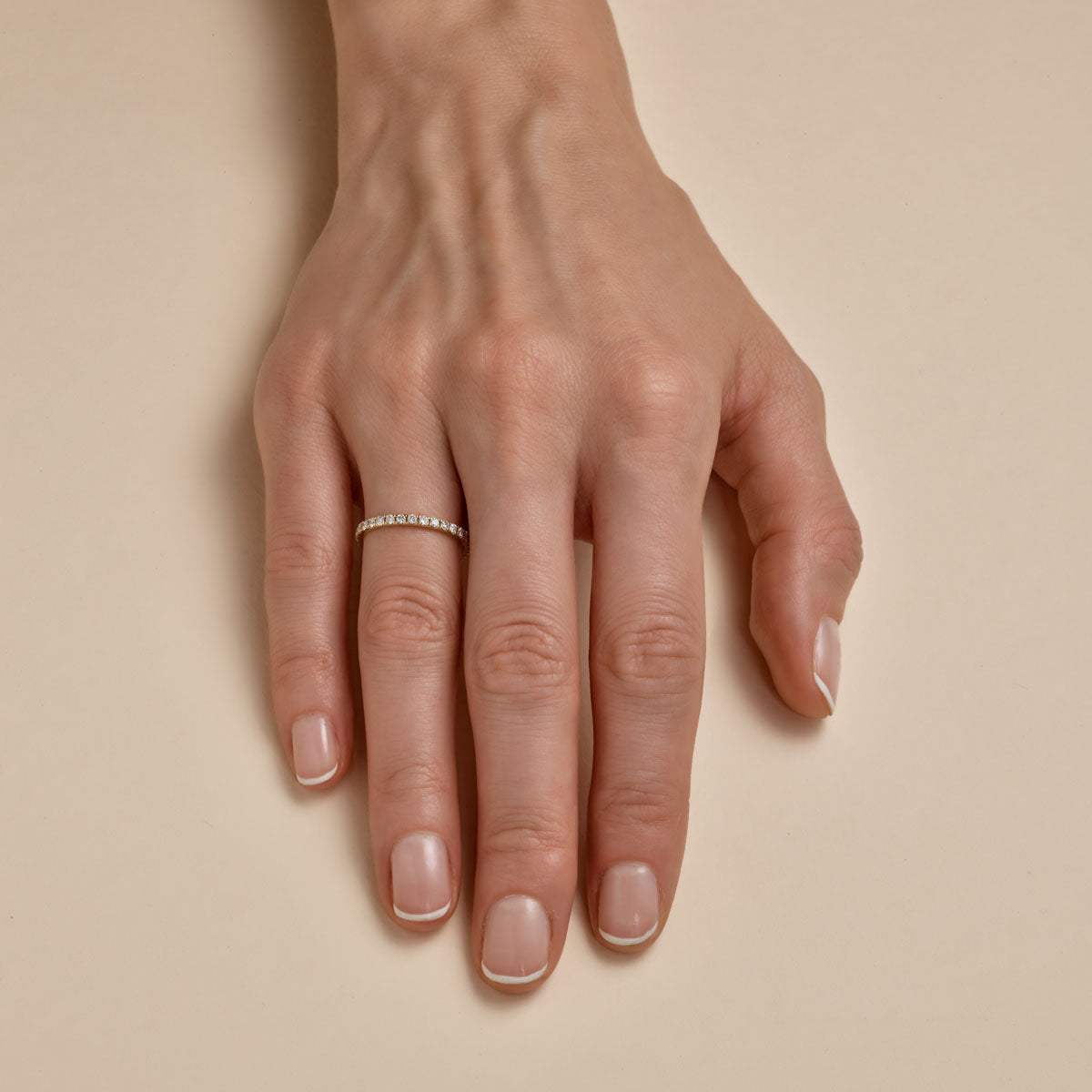 2pt diamond eternity band on womans finger