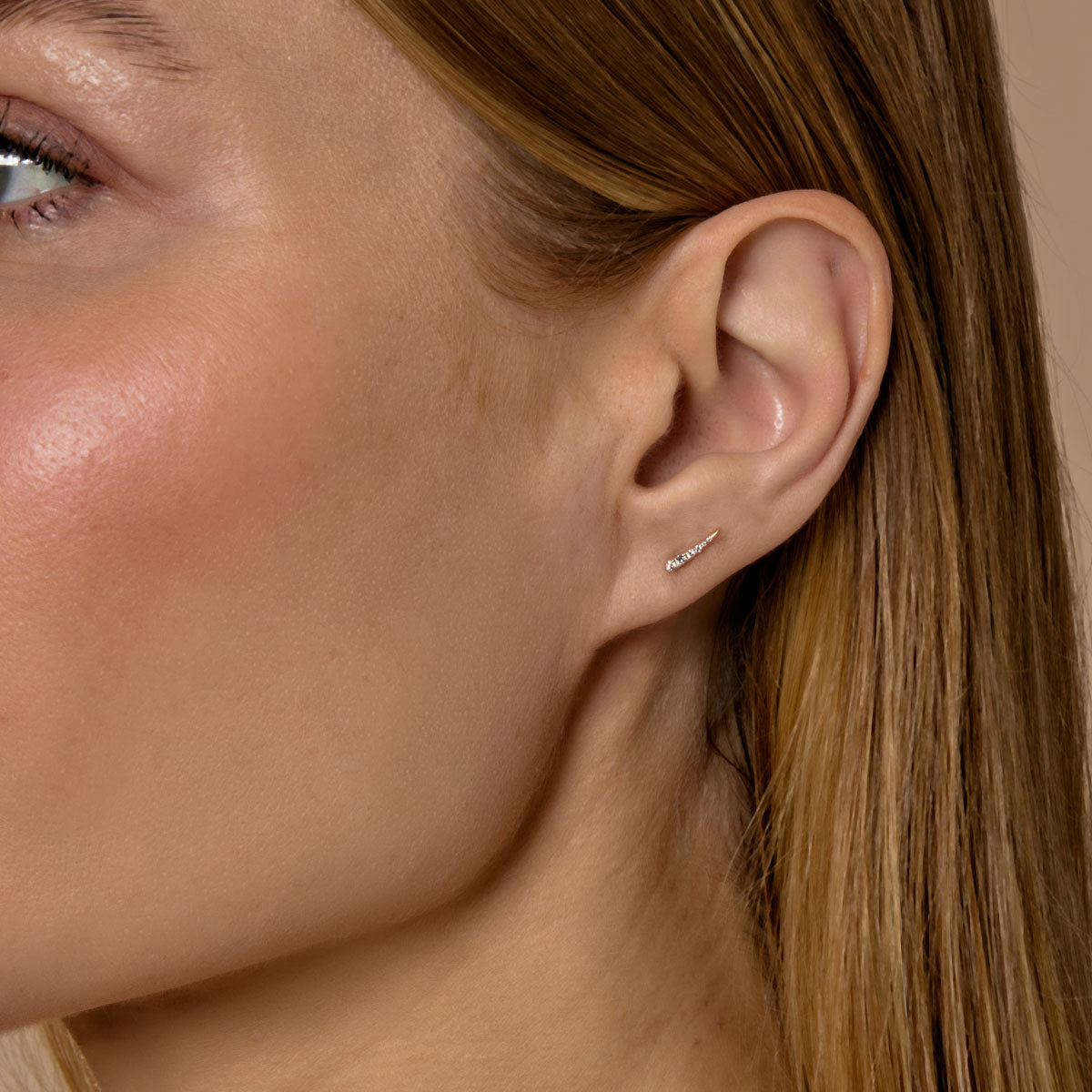 diamond eyelash stud earrings on model