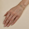 multiple gold bracelets stacked on womans hand_1_8a3e56a0 6e30 4576 96d5 701fb10f167a