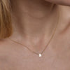 Complete your look with a gold initial necklace, a stunning addition to your ensemble.