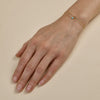 Layered gold and diamond bracelets - luxurious stacked jewelry on woman's wrist
