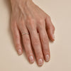 Pave diamond crossover gold ring - sparkling modern design on woman's finger