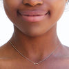 sagittarius diamond zodiac necklace on womans neck