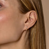 tapered baguette diamond spike earring on ear