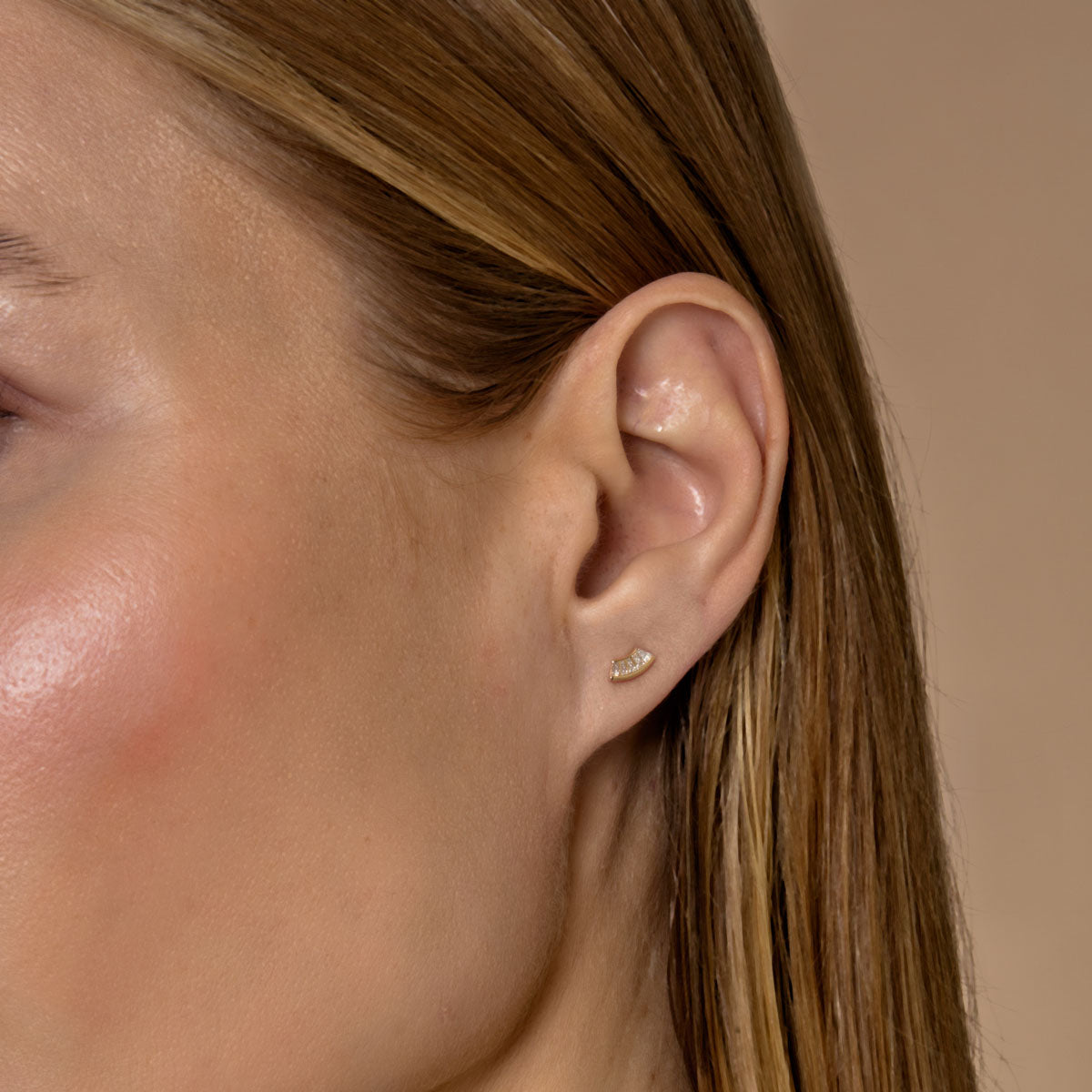 white diamond fan earrings on ear