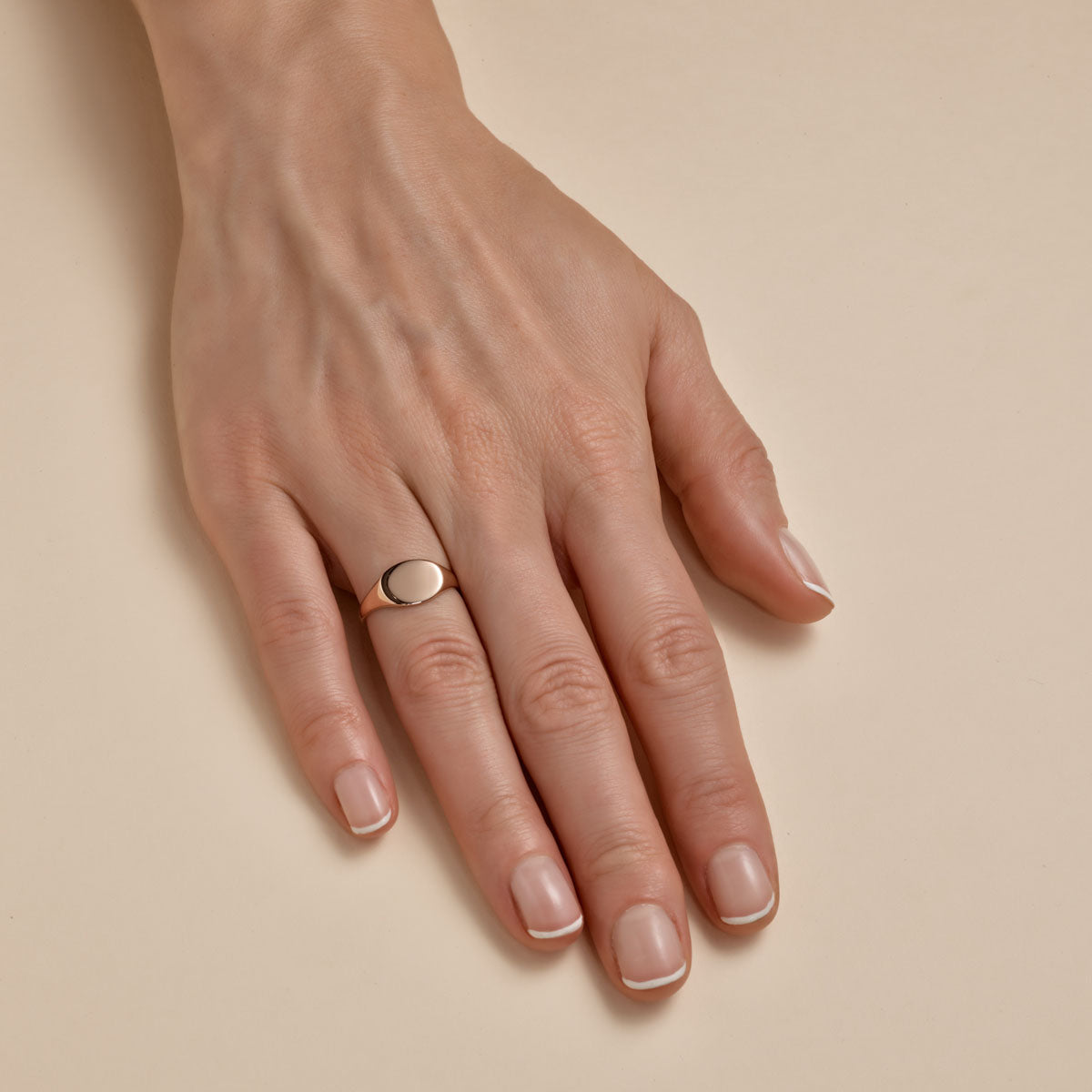 Classic women's gold signet ring - timeless personalized jewelry on finger